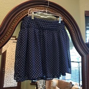 Navy blue and white polka dot mini skater skirt